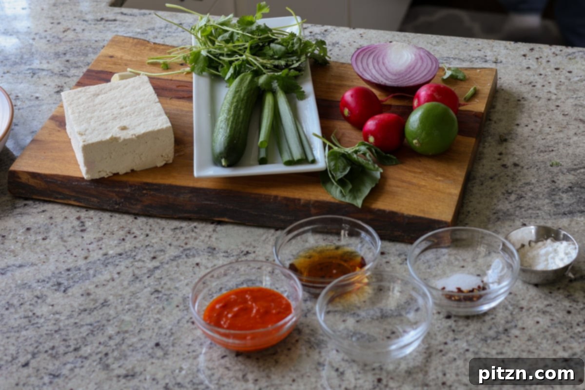 30-Minute Harissa Tofu Bowls for All Diets 7 harissa tofu bowl ingredients on the kitchen counter