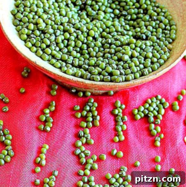 Close-up of Green Mung Daal in a white bowl with a spoon, highlighting its texture