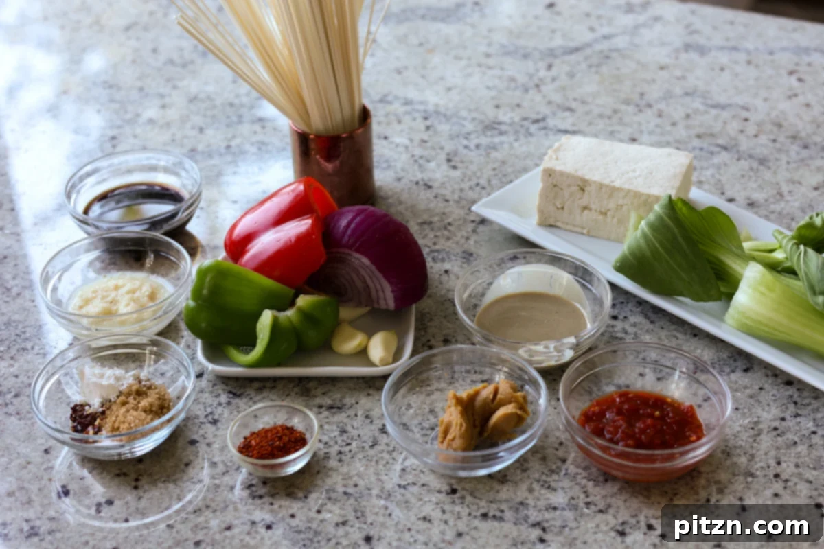 assortment of tahini ramen ingredients neatly arranged on a kitchen counter, showcasing fresh produce and pantry staples