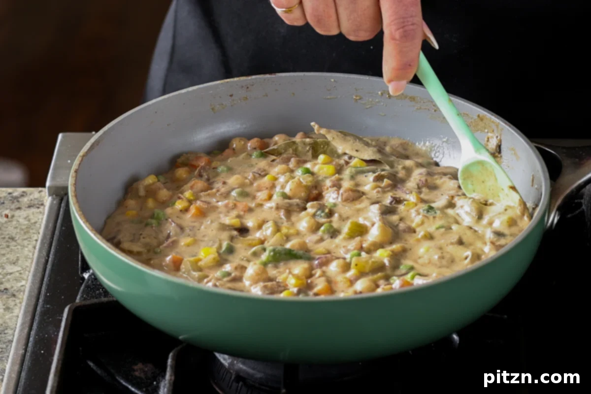 Thickened pot pie filling in the pan after cooling.
