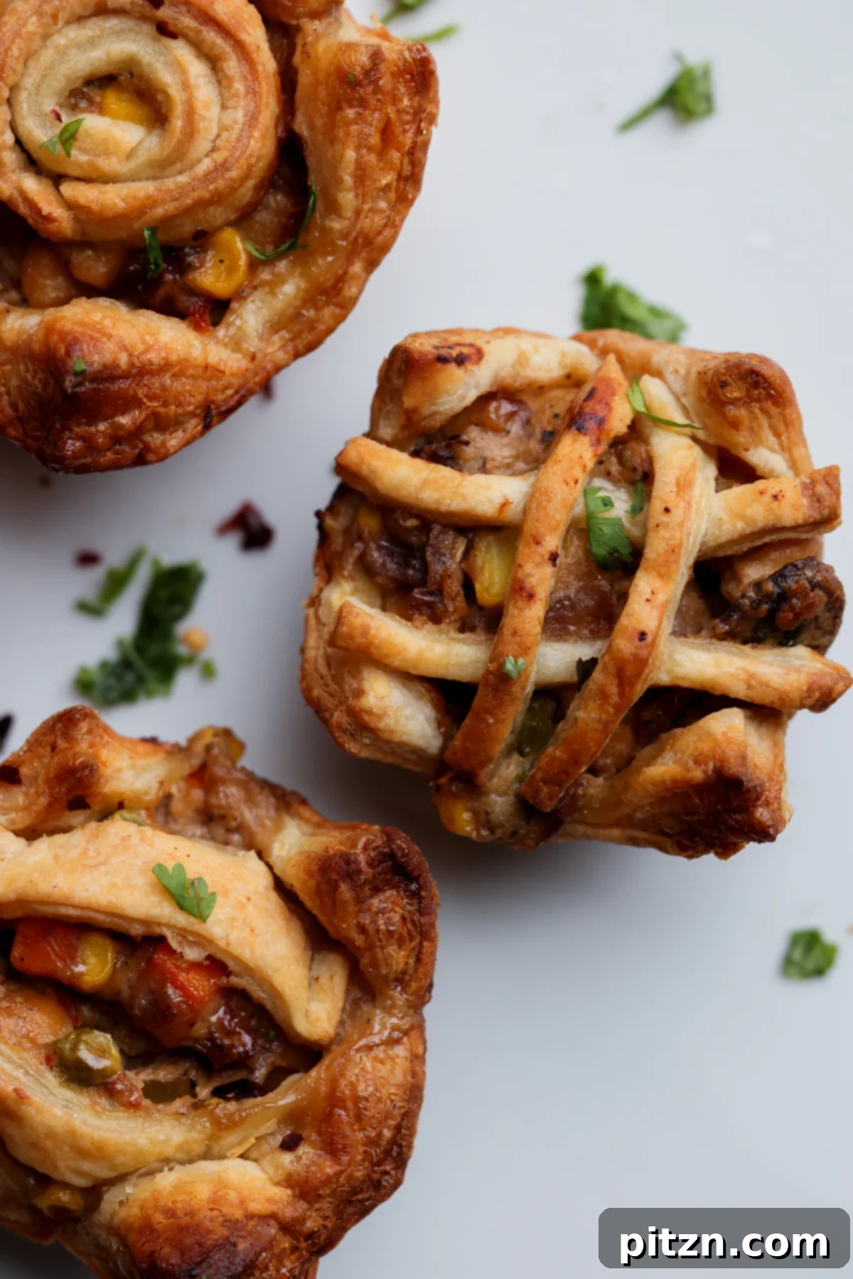 Mini pot pie with an intricate lattice puff pastry crust design.