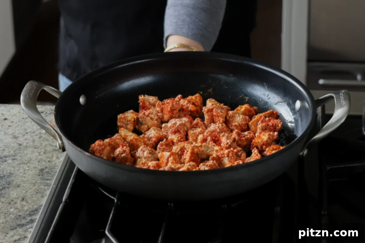 adding tofu to the pan