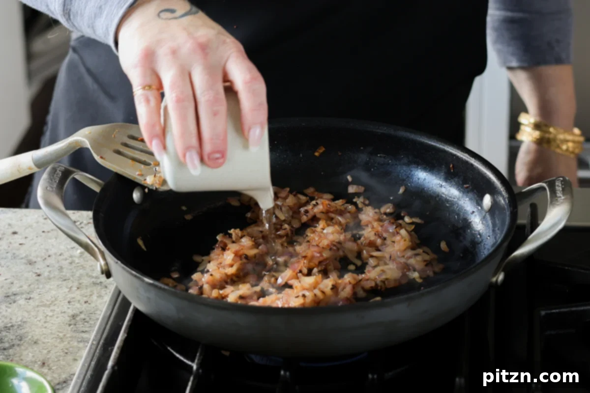 adding water to the onion