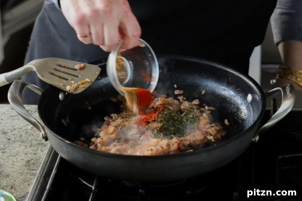 adding ground spices to the pan