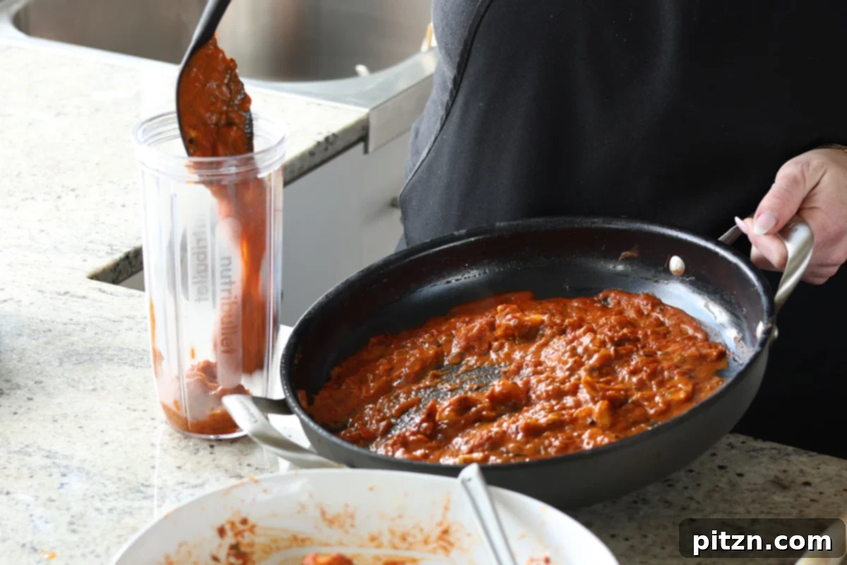 transferring the sauce to a blender