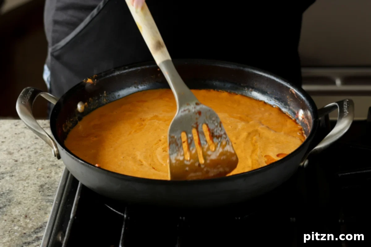 bringing the blended sauce mixture to a boil I the pan