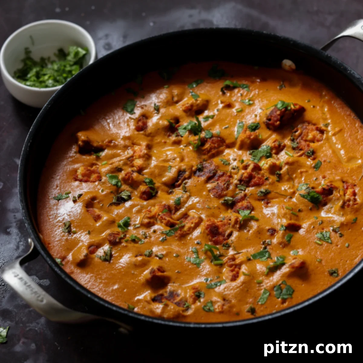 restaurant-style butter chicken in the pan