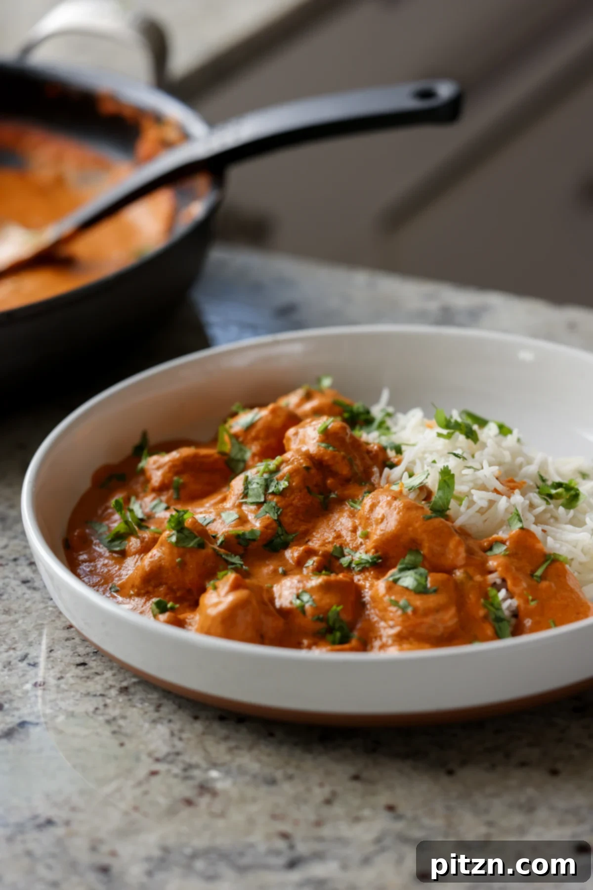 plate of vegan butter chicken with rice