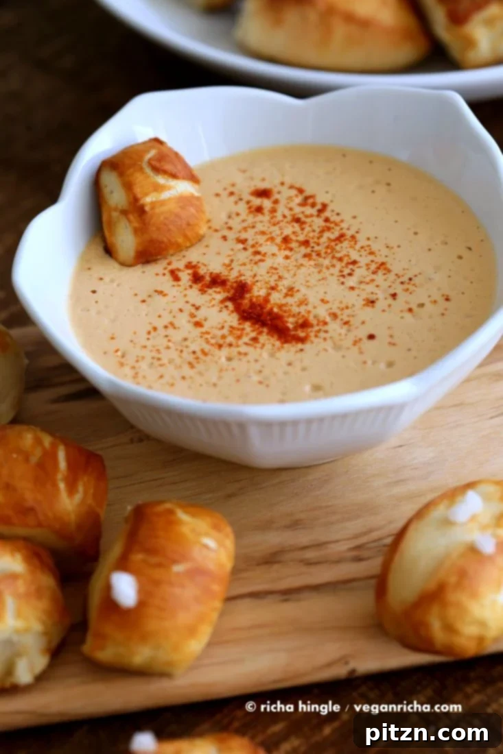 A final shot of Vegan Pretzel Bites with dip, emphasizing their golden crust and appealing presentation.