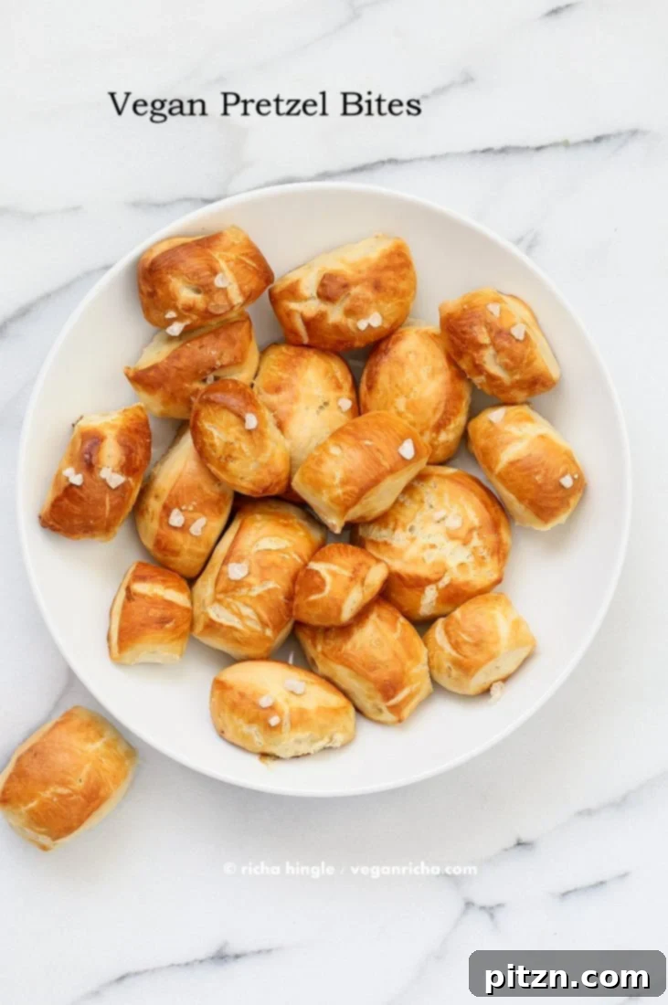 A close-up of freshly baked Vegan Pretzel Bites, ready to be dipped.