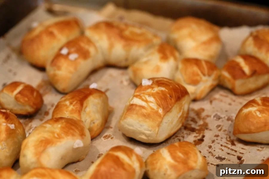 Brushing Vegan Pretzel Bites with baking soda wash, then cornstarch wash, and sprinkling with salt before baking.
