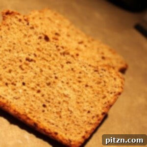 Close-up of a rustic gingerbread loaf, showcasing its rich, spiced aroma and inviting texture.