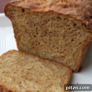 Artisan Molasses Raisin Oat Flax Loaf 5 Grape Oats Flaxseed Molasses Wheat Bread, a wholesome vegan loaf with a unique blend of ingredients, perfect for a healthy diet.