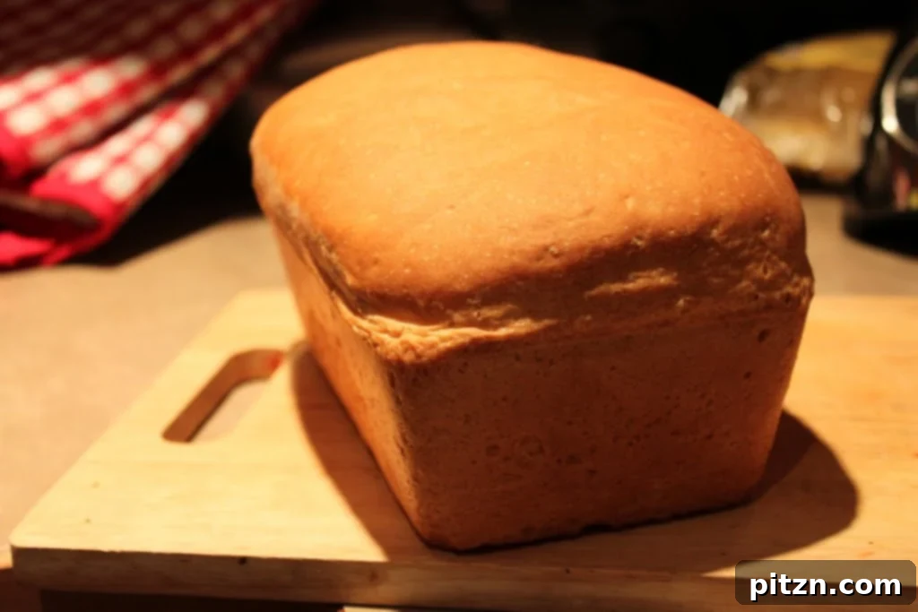 Two slices of the homemade vegan white sandwich loaf, showcasing its fluffy texture and even crumb.