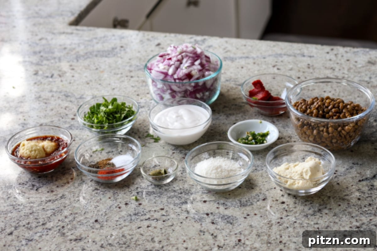 South Indian Soulmate Lentils 7 All ingredients for Marry Me Lentils laid out on a wooden surface before cooking.
