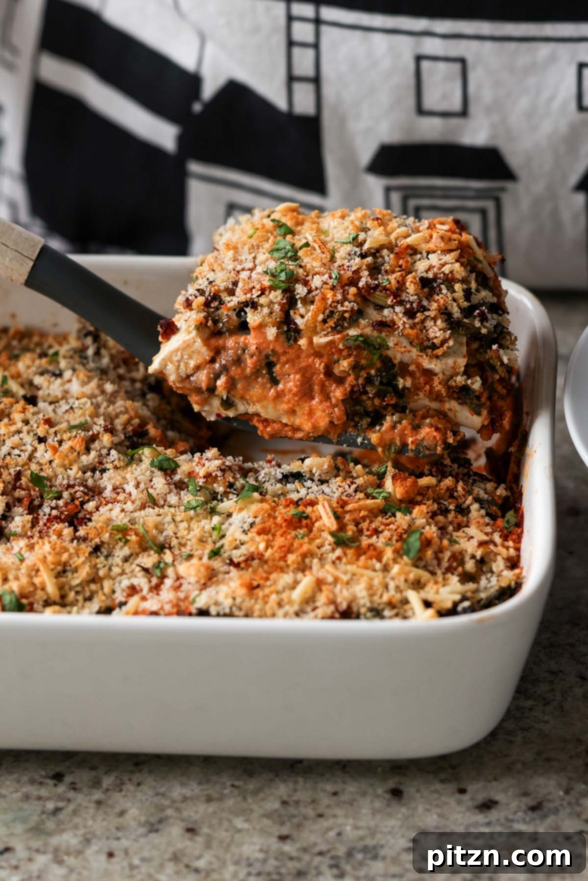 Marry Me Tofu Lasagna Bake 2 serving a piece of the marry me tofu bake