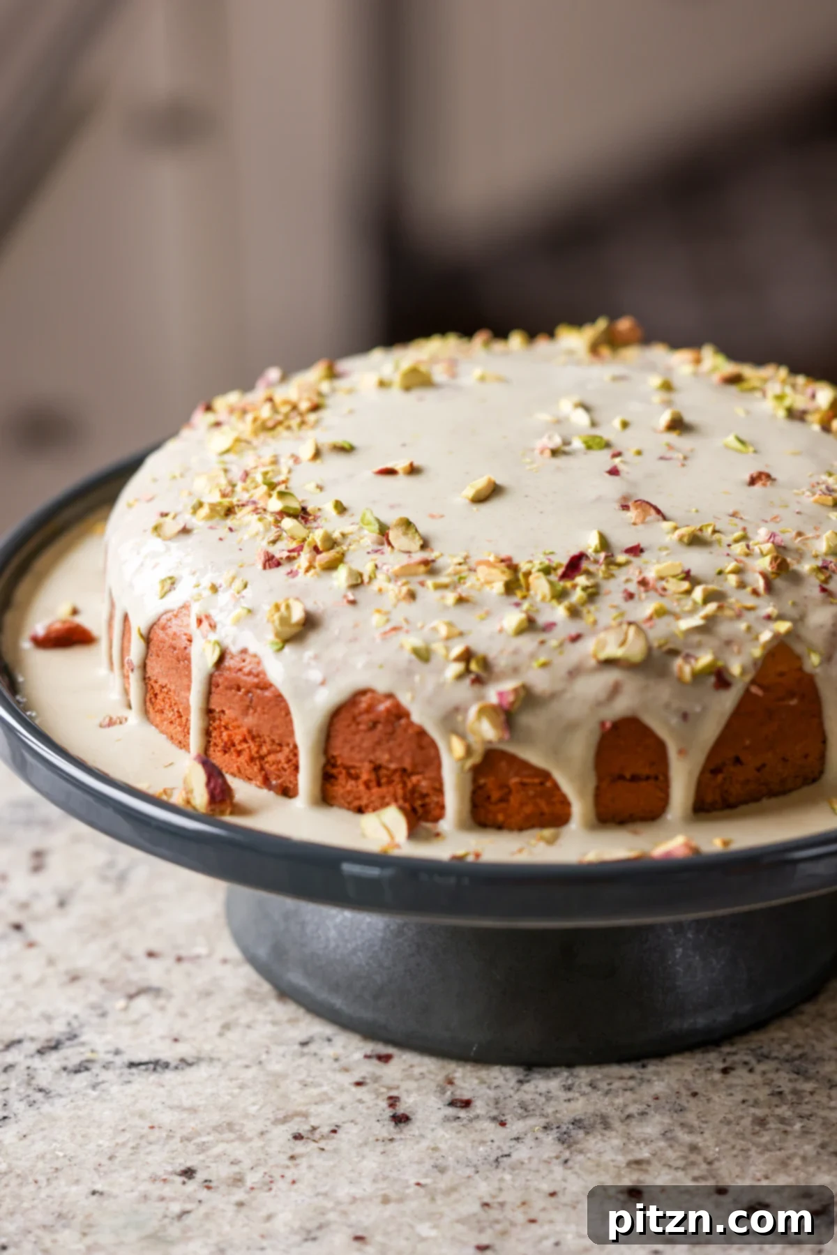 Pistachio Perfection Trio 2 A stunning triple pistachio cake displayed elegantly on a cake stand, showcasing its vibrant green hue and inviting texture.