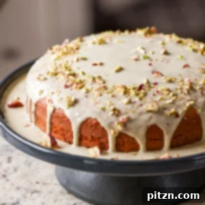 triple pistachio cake on a cake stand