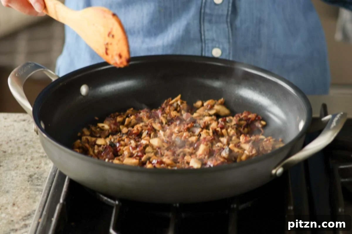 Zesty Mediterranean Butter Beans 11 cooked mushrooms and aromatics in the pan