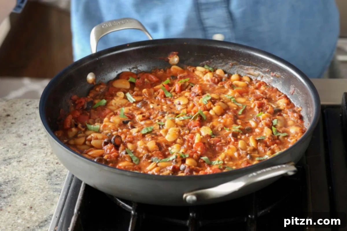 Zesty Mediterranean Butter Beans 17 puttanesca beans in the pan after simmering