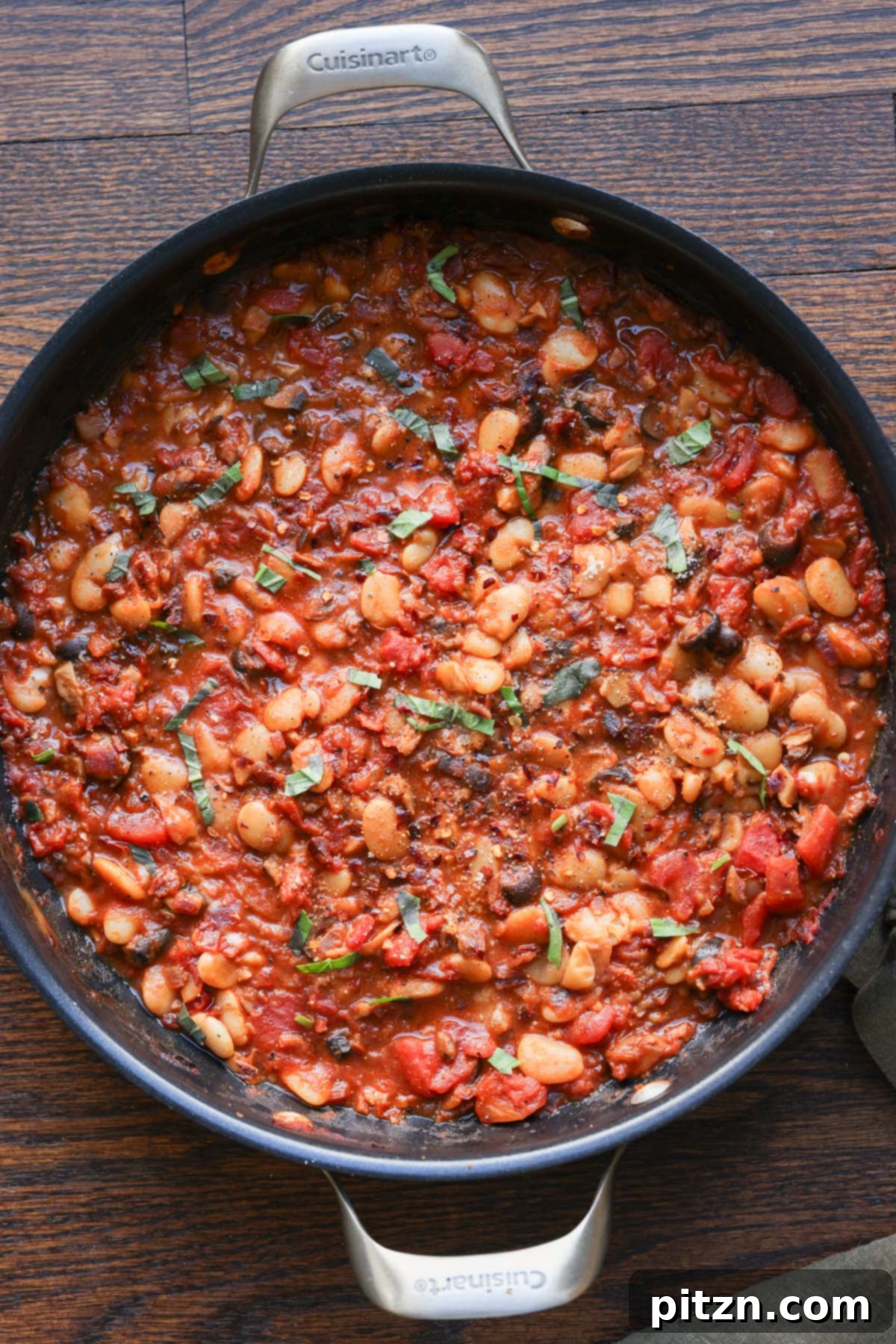 Zesty Mediterranean Butter Beans 5 pan of puttanesca beans on a wooden table