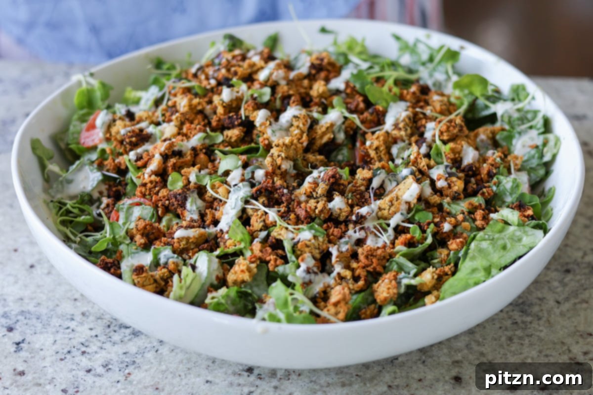 Sun-Drenched Spinach Salad with Zesty Olive-Chickpea Crunch 14 The fully assembled summer spinach salad with chickpea olive crumbles in a large serving bowl, ready for plating.