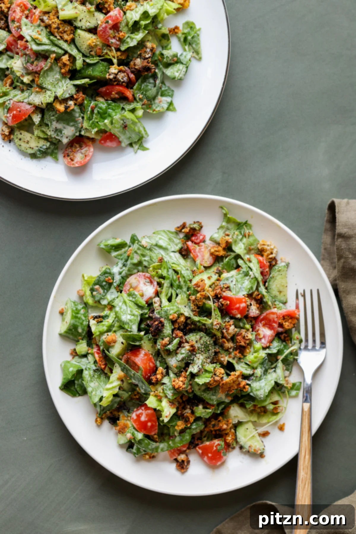 Sun-Drenched Spinach Salad with Zesty Olive-Chickpea Crunch 5 Individual plates of summer spinach salad featuring a colorful array of ingredients and chickpea olive crumbles.