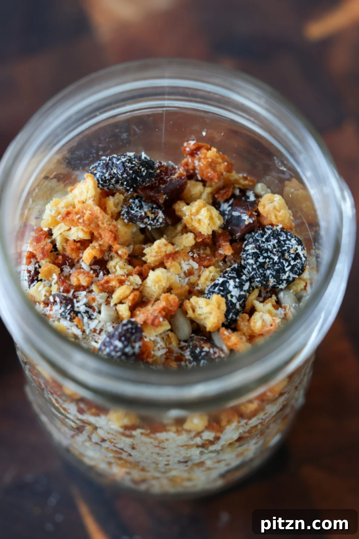 Bowl of red lentil granola with fresh berries and coconut