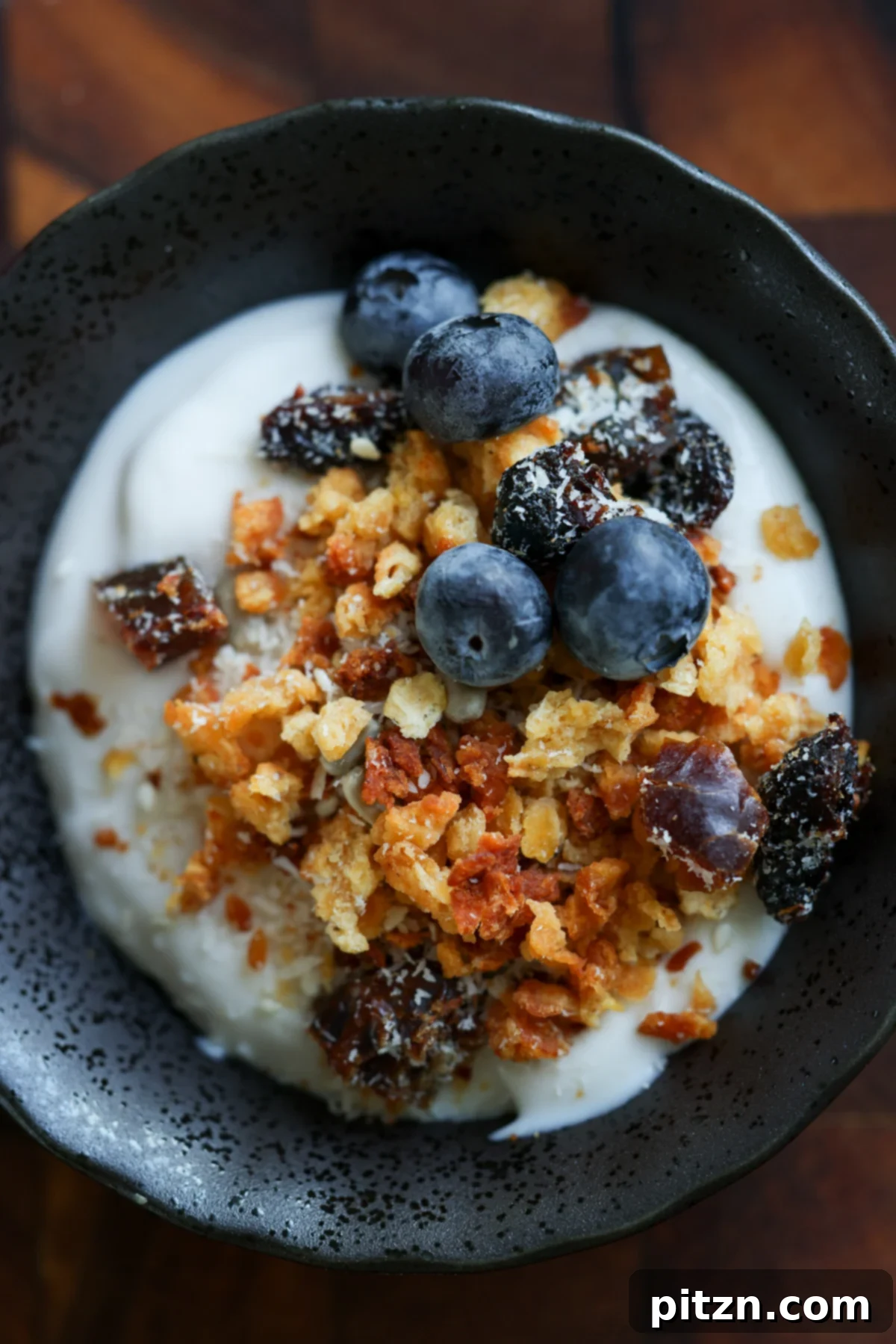 A vibrant bowl of red lentil granola with fresh toppings