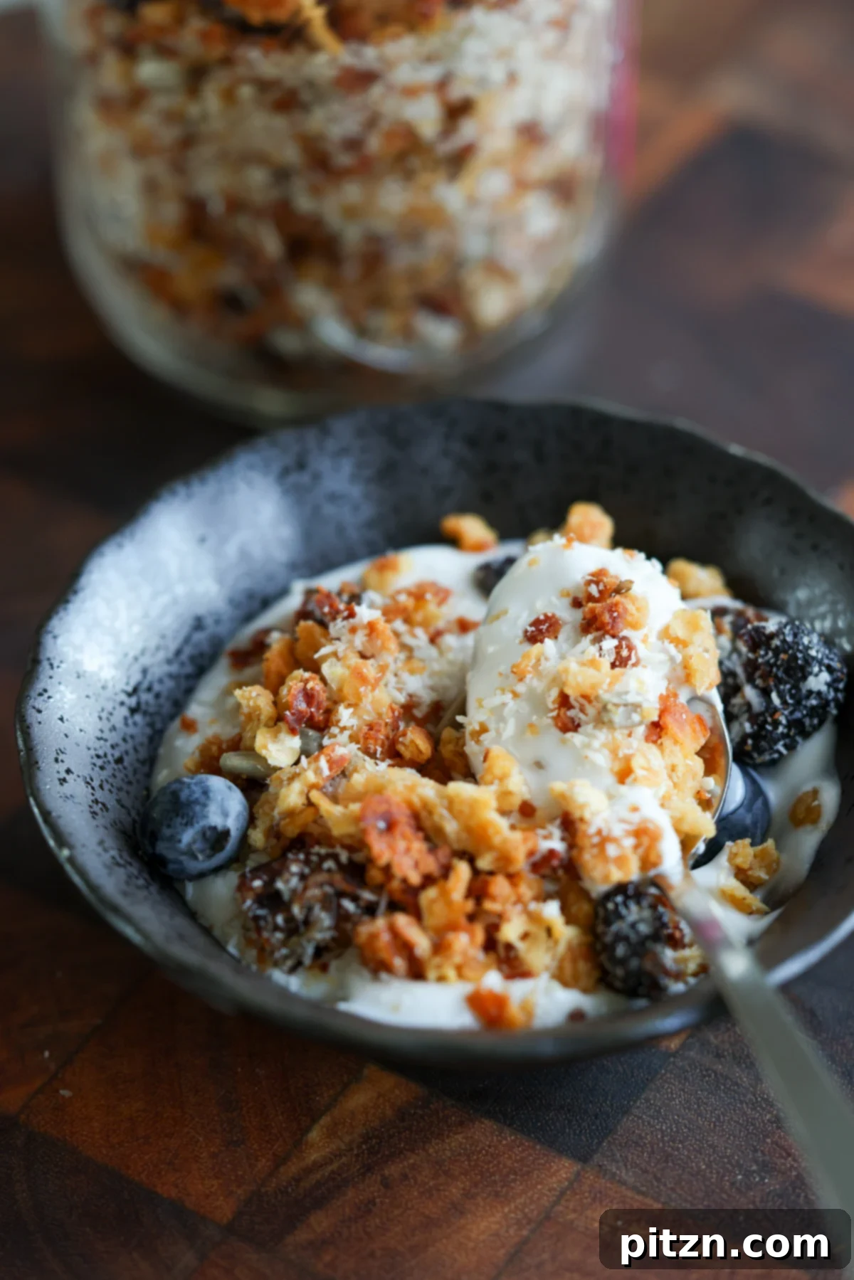 Overhead shot of red lentil granola on a baking sheet, freshly baked
