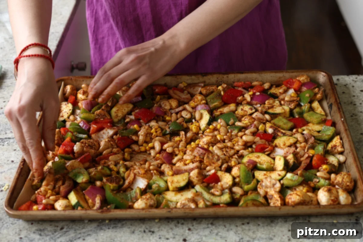 One-Pan Smoky Cajun Veggies and Smashed White Beans 12 tossing beans and veggies in spices and sauce