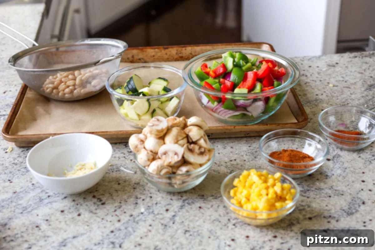 One-Pan Smoky Cajun Veggies and Smashed White Beans 8 cajun sheet pan beans veggies ingredients after prepping