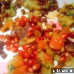 Sunday's Tangy Aloo Tikki Delight 2 Close up of Tikki Chaat on a white plate, garnished with chutney and herbs