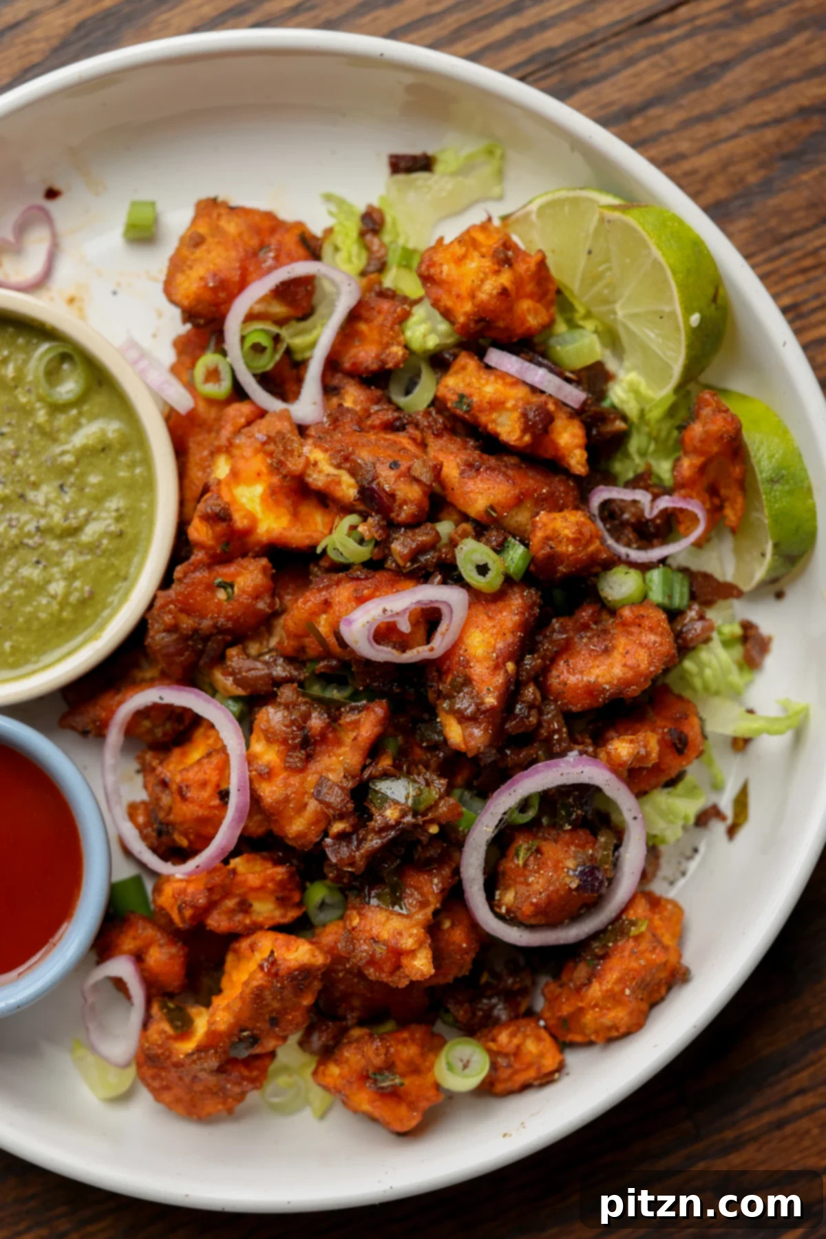 Crispy Vegan 555 Chicken Bites 2 Crispy Vegan Chicken 555 on a plate, ready to be dipped in vibrant chutneys.
