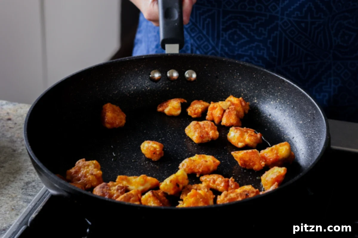 Crispy Vegan 555 Chicken Bites 18 Perfectly crispy tofu in the pan after frying.