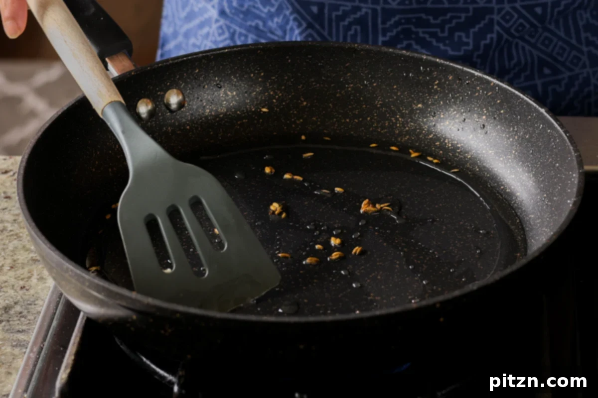 Crispy Vegan 555 Chicken Bites 19 Roasting whole spices, including fennel seeds, in a pan to develop their flavors.