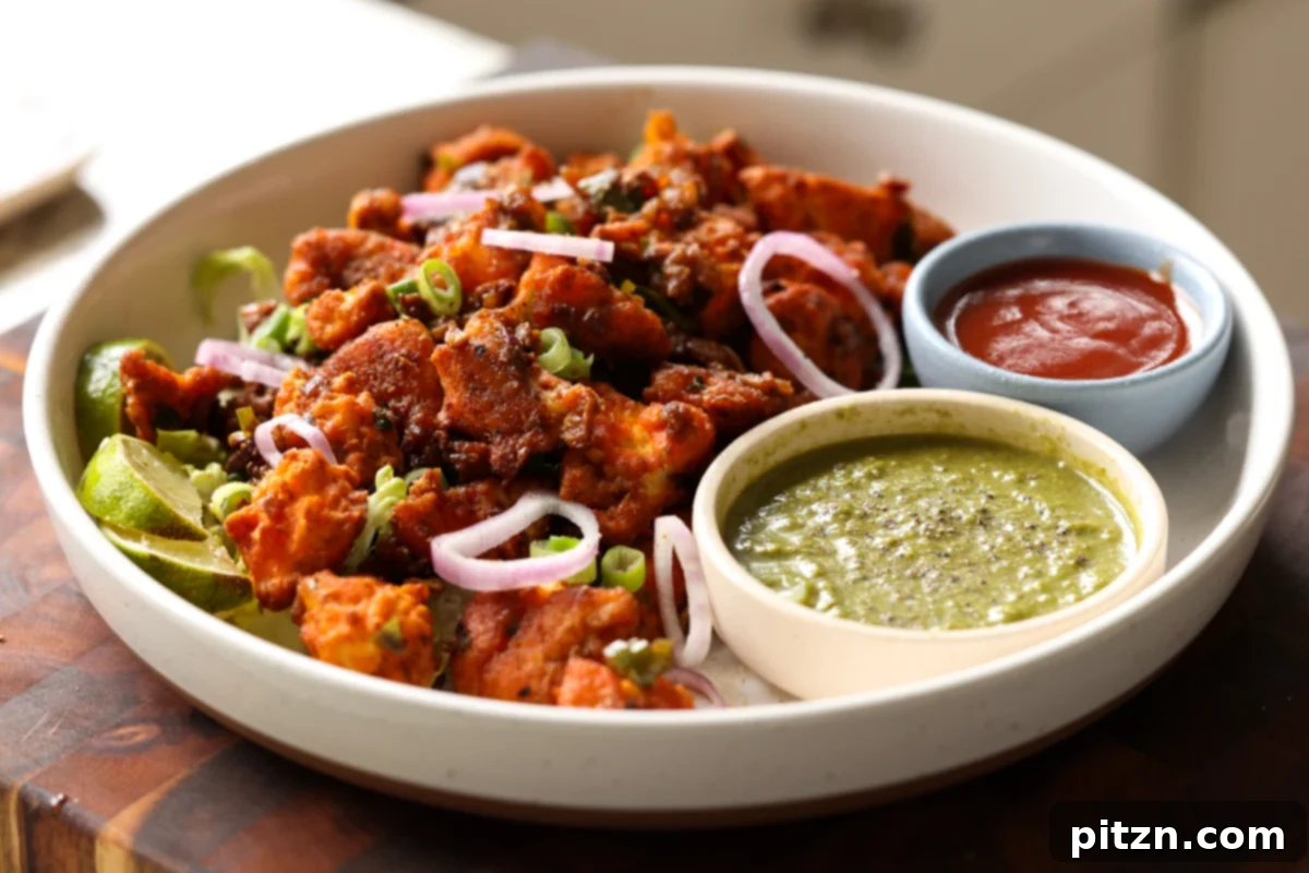 Crispy Vegan 555 Chicken Bites 27 A serving of Vegan Chicken 555 on a plate, perfectly arranged with accompanying chutneys for dipping.