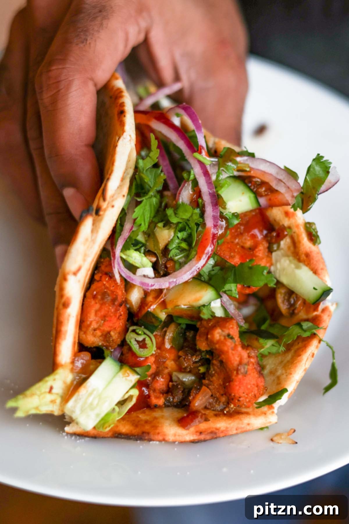 Crispy Vegan 555 Chicken Bites 5 Delicious wrap filled with fresh vegetables and flavorful Vegan Chicken 555.