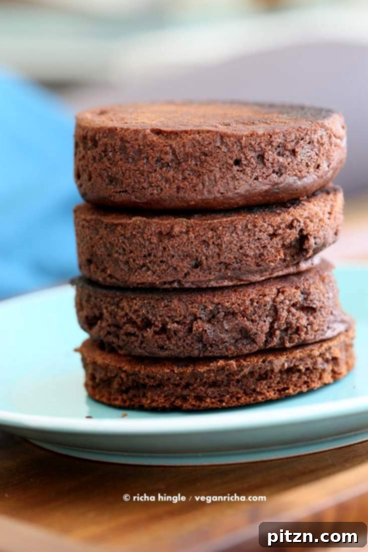 Flipping a vegan chocolate cake layer on the stovetop