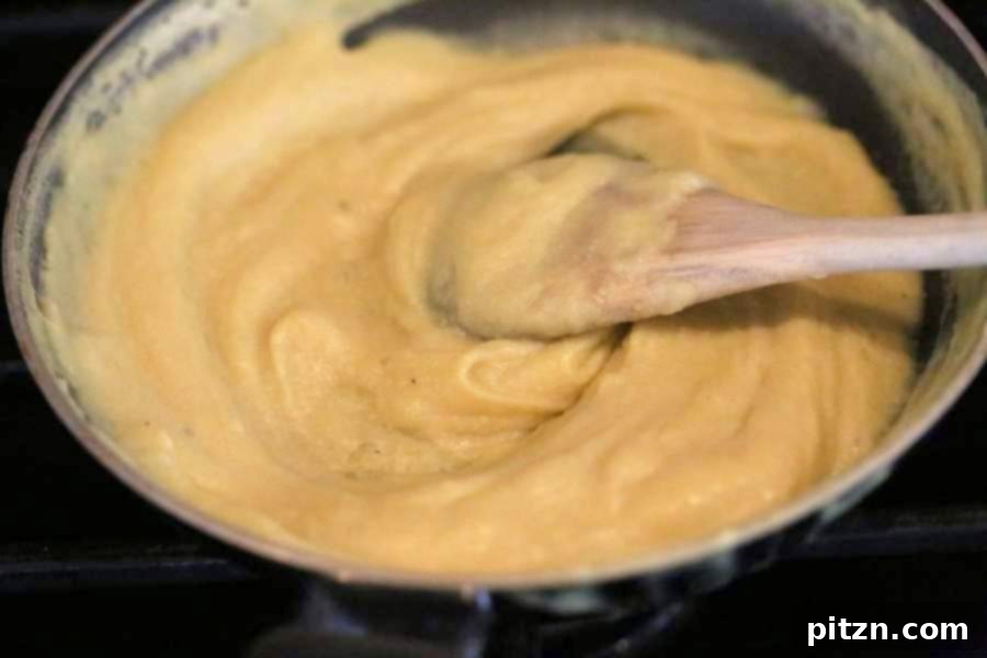 Savory Garlic Tomato Sauce over Vegan Chickpea Pasta 5 Cooking chickpea flour mixture in a pan until it thickens into a custard, a key step for homemade vegan noodles.