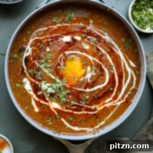 Restaurant-Quality Dal Makhani at Home 21 dal makhani in the pan with tadka and toppings