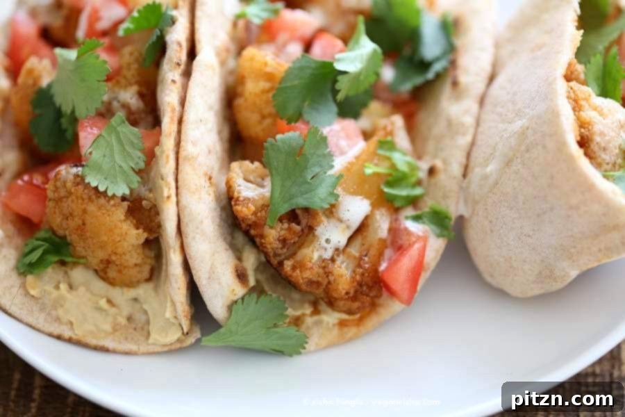 Vegan Shawarma: Spiced Cauliflower Wraps with Hummus & Tahini 3 Cauliflower Shawarma in a wrap with hummus and tahini dressing