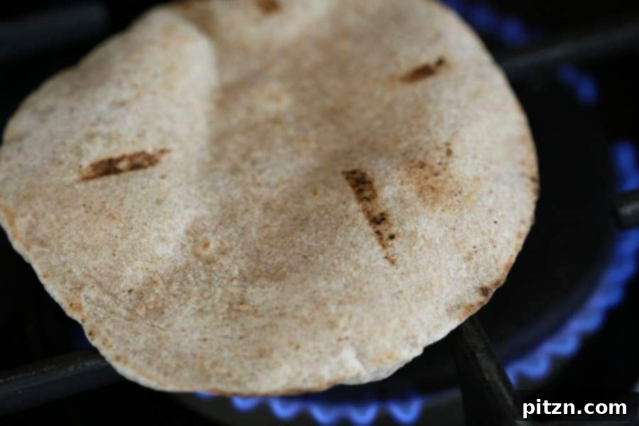 Easy Fluffy Vegan Pita Bread 4 Vegan Pita Bread Puffing Up on a Gas Stove