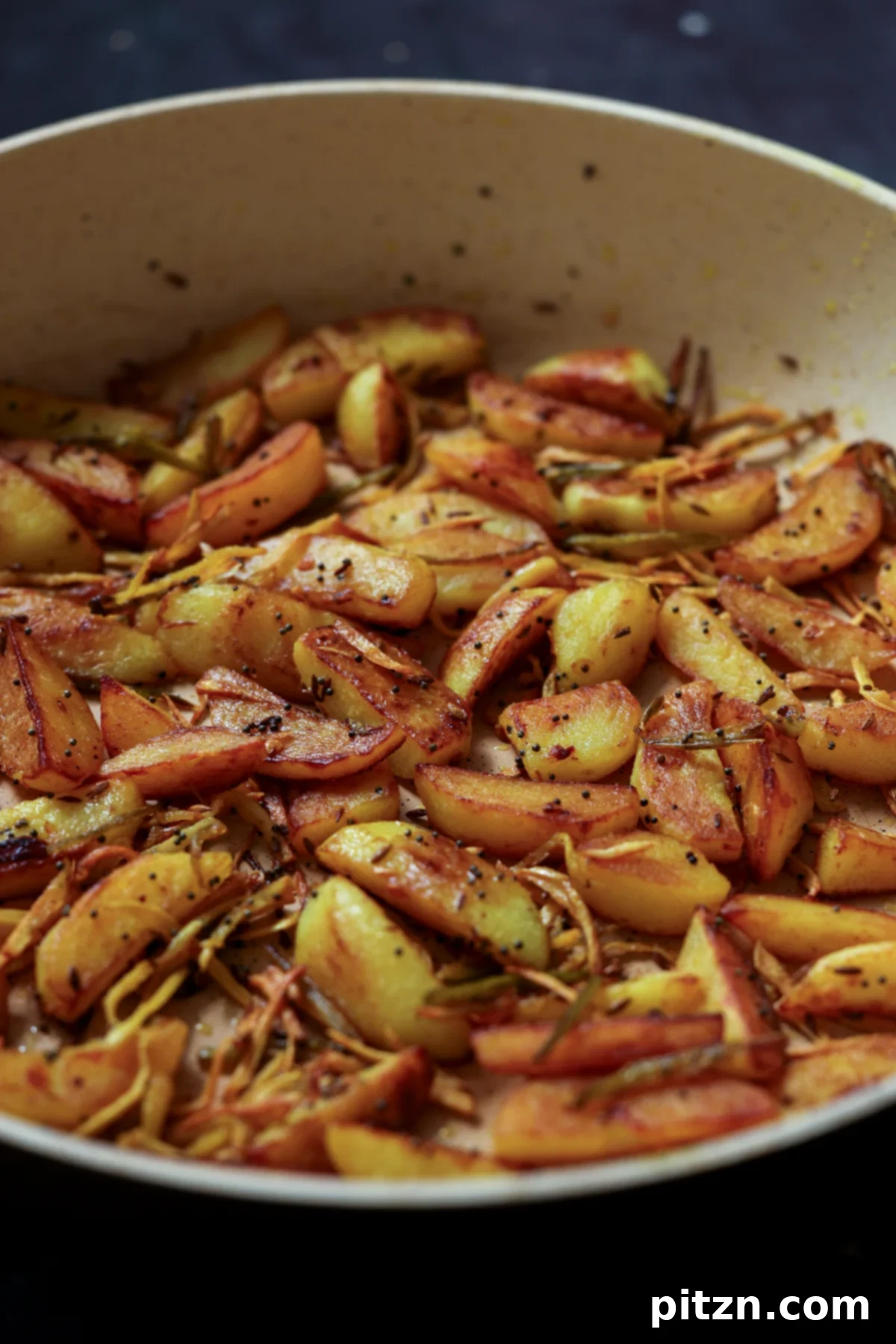 side view of Nepali aloo in the pan after cooking