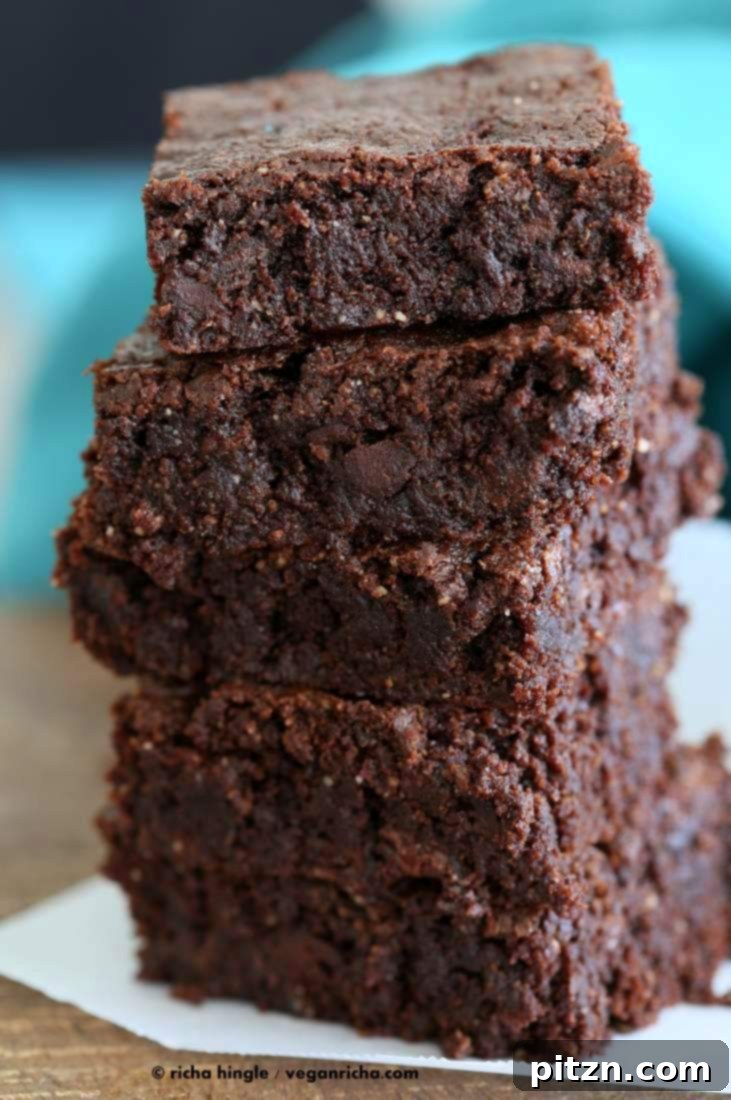 Decadent Vegan Gluten Free Brownies Made Easy 3 Close-up of baked Gluten-Free Vegan Brownies, showcasing their rich, dark texture.