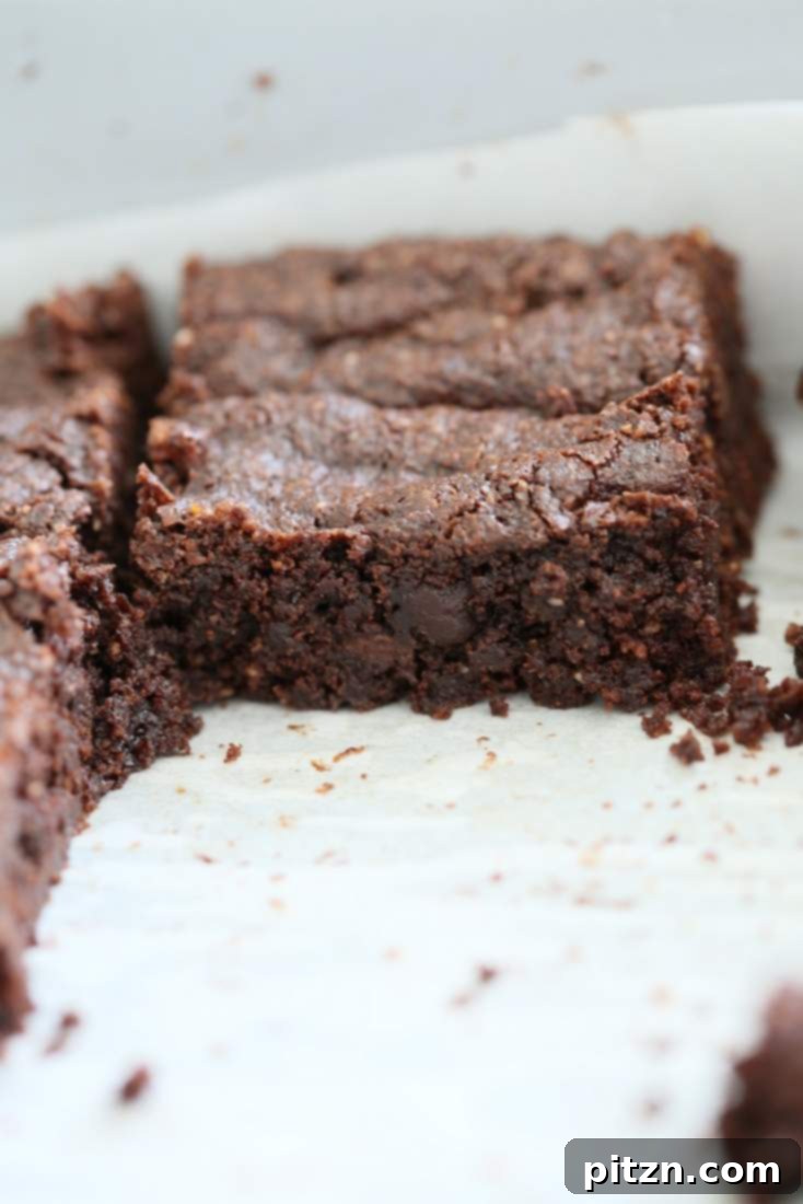 Decadent Vegan Gluten Free Brownies Made Easy 10 Sliced Gluten-Free Vegan Brownies on a serving platter, ready to be enjoyed.