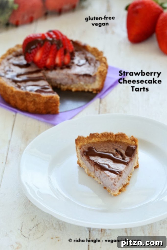 Indulgent vegan strawberry cheesecake tart, showcasing its rich and creamy filling