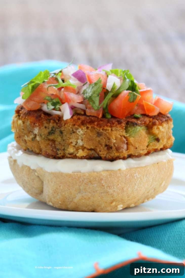 The Tri-Veggie Power Burger 4 Vegan Pinto Bean Broccoli Lentil Burgers stacked with fresh garnishes | Vegan Richa