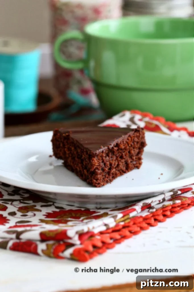 Decadent Vegan Chocolate Torte 5 Slice of Vegan Chocolate Torte with a rich, dark glaze