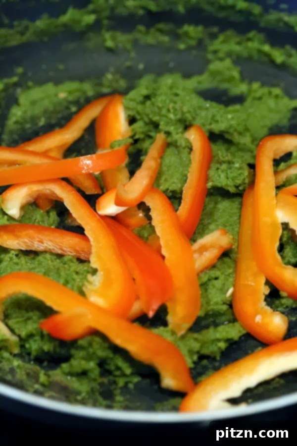 Adding cauliflower and bell pepper to the curry base